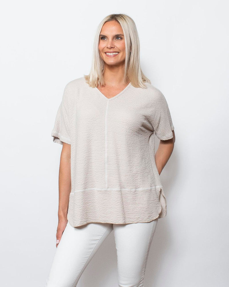 Snoskins Seersucker Knit V-Neck Body skimming with button detail at hip Matching thread Style 77585-24S