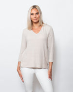 Snoskins Seersucker Knit V-Neck Body skimming with button detail at hip Matching thread Style 77585-24S