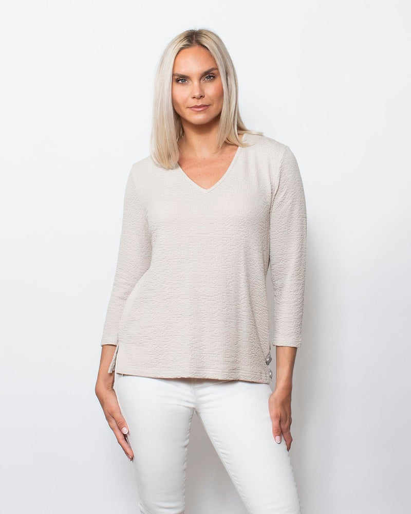 Snoskins Seersucker Knit V-Neck Body skimming with button detail at hip Matching thread Style 77585-24S