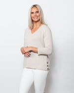 Snoskins Seersucker Knit V-Neck Body skimming with button detail at hip Matching thread Style 77585-24S